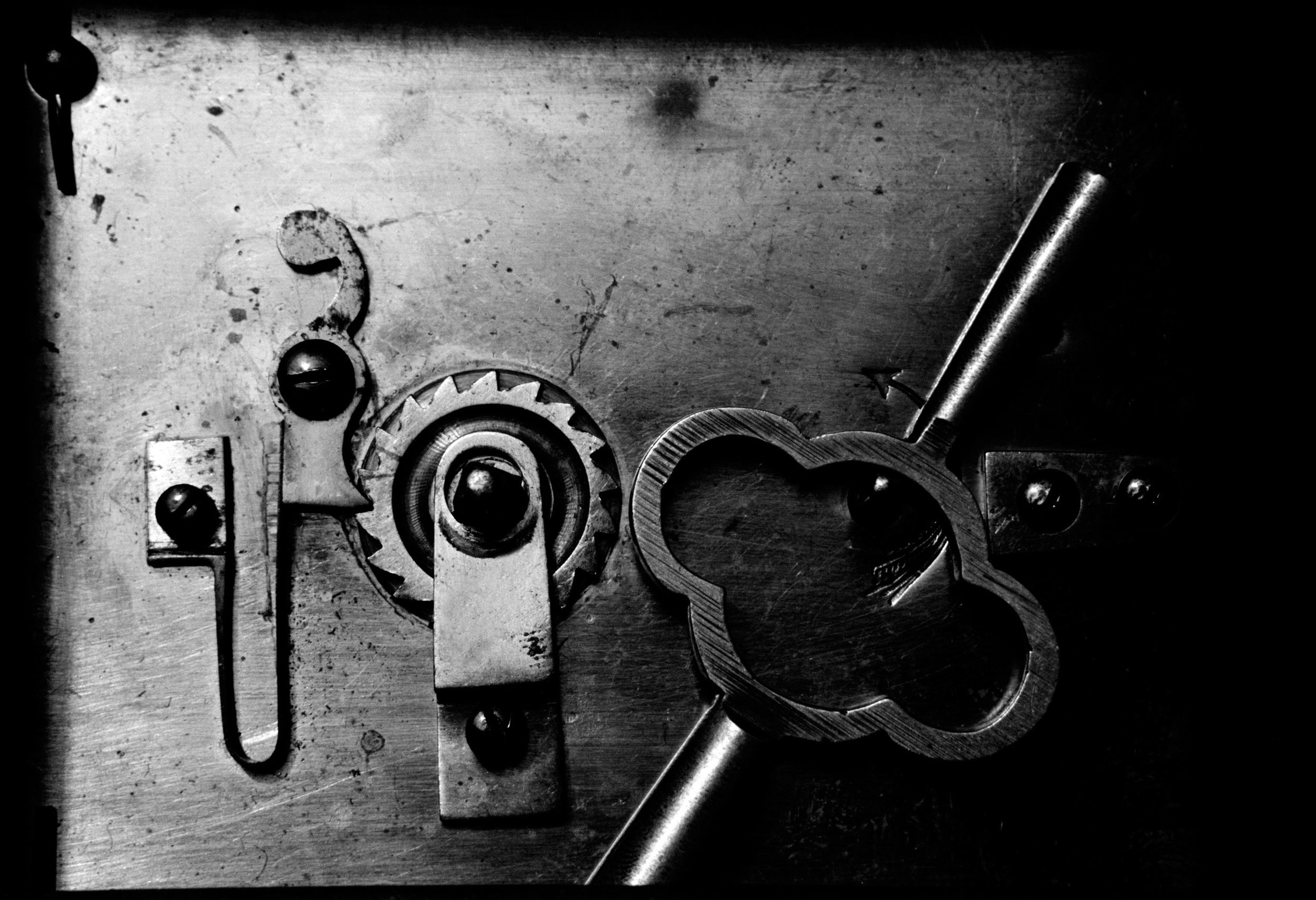 Close-up of clockwork representing intricate escape room mechanisms