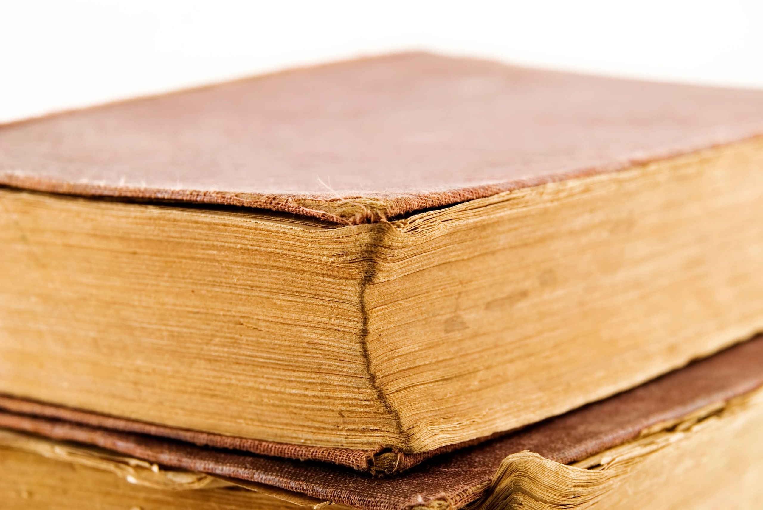 Stack of antique books for printable historical mystery inspiration
