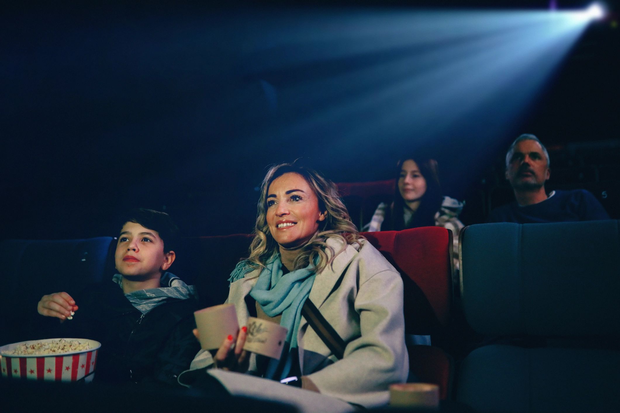 Parent and child enjoying a fun movie outing together