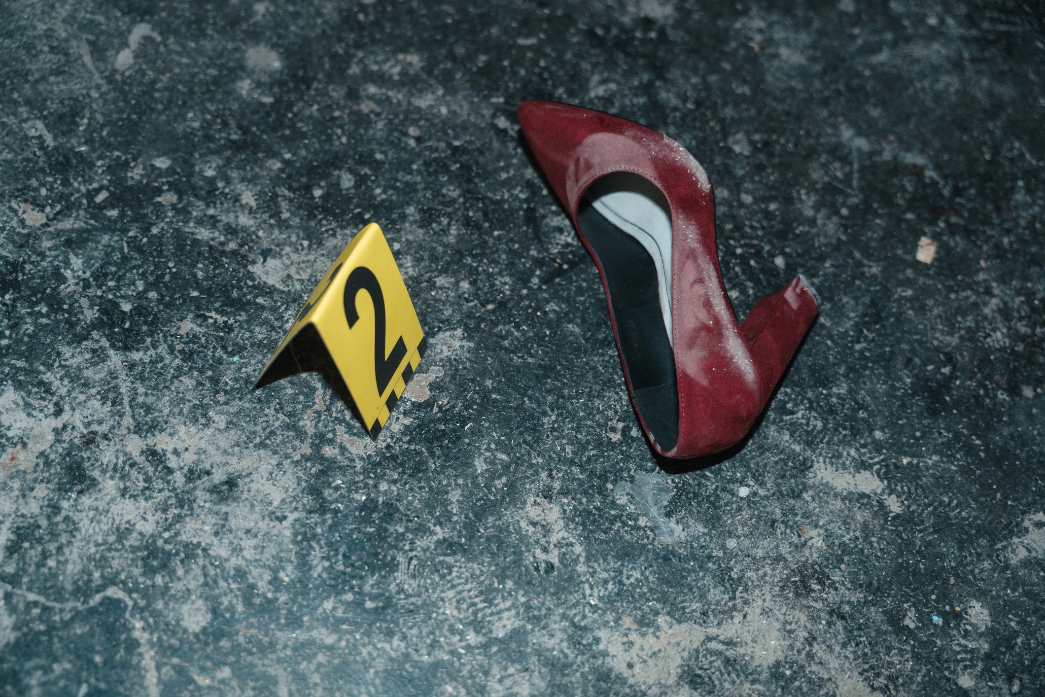 Crime scene evidence marker beside a clue for observation puzzles