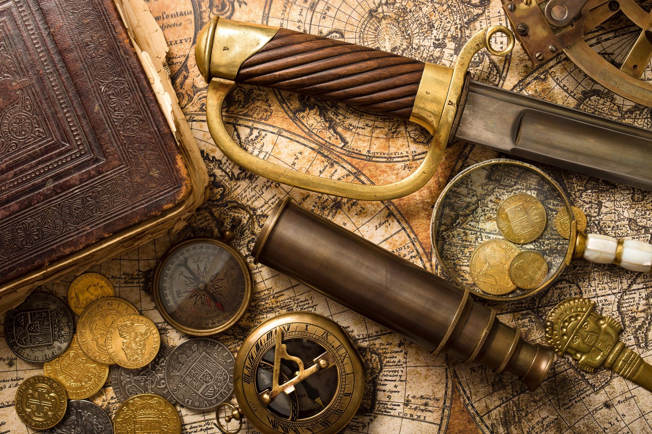 Vintage treasure-themed still life with coins and old objects