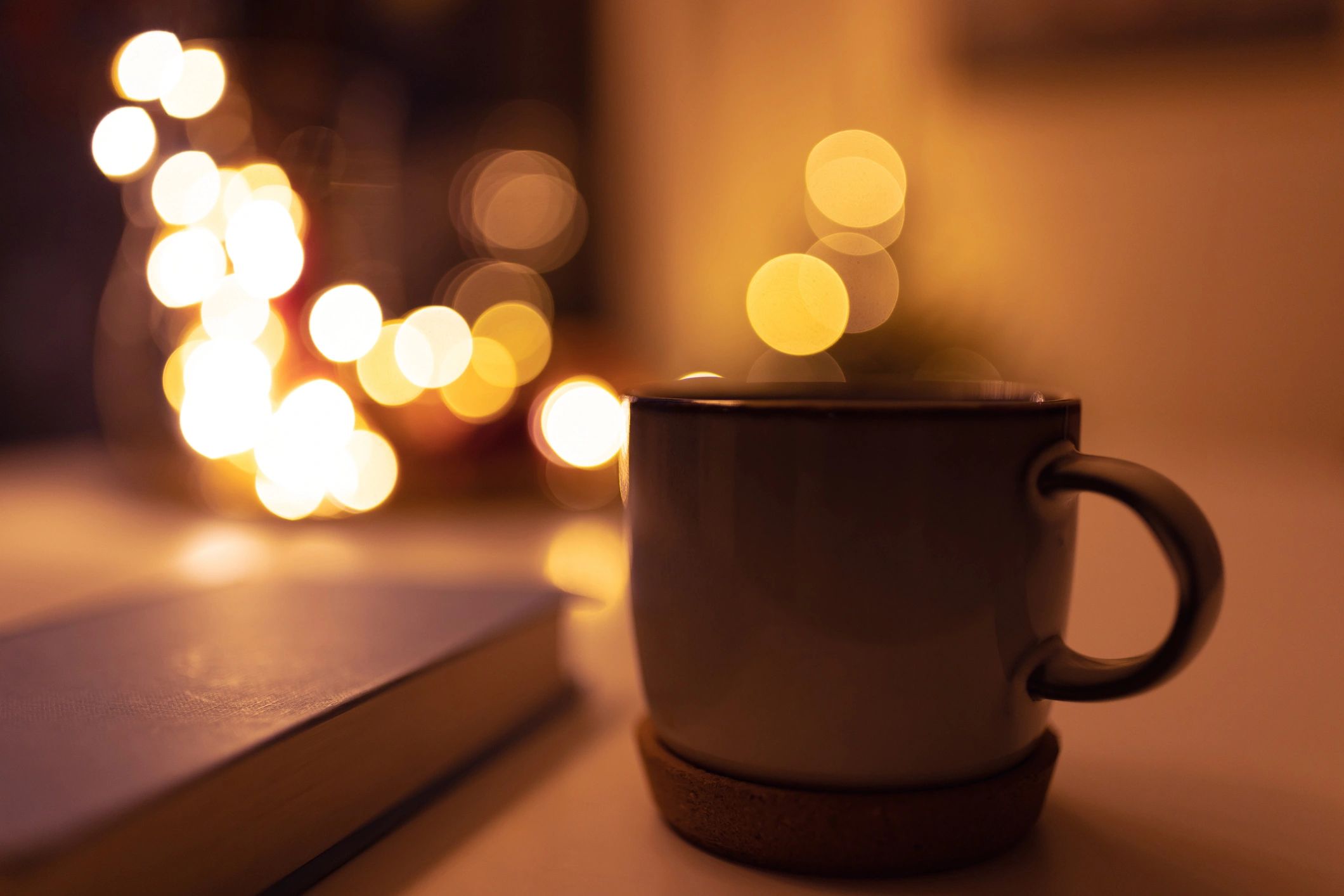 Book and tea arranged for a cozy reading night