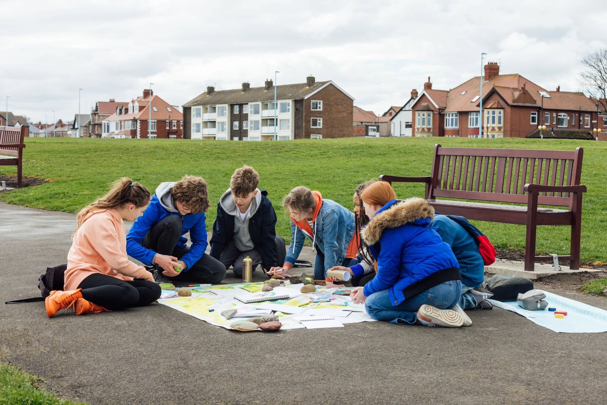 Group gathered for a creative activity that suggests collaborative family puzzle time