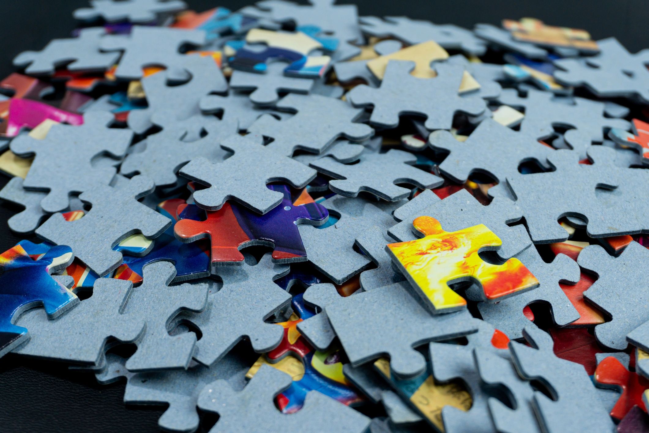Unfinished puzzle pieces representing clue structure and progression