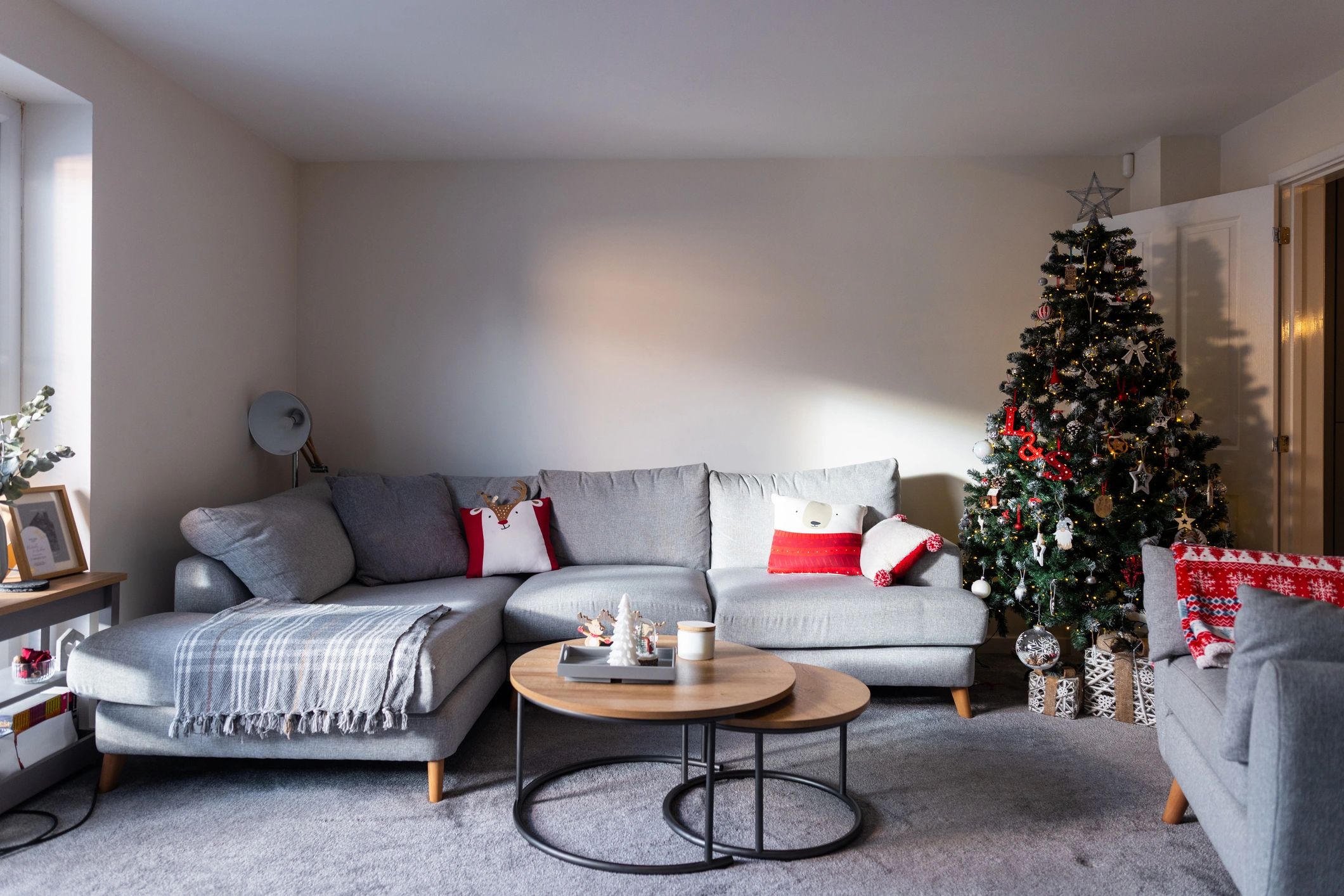 Holiday-decorated living room with Christmas tree