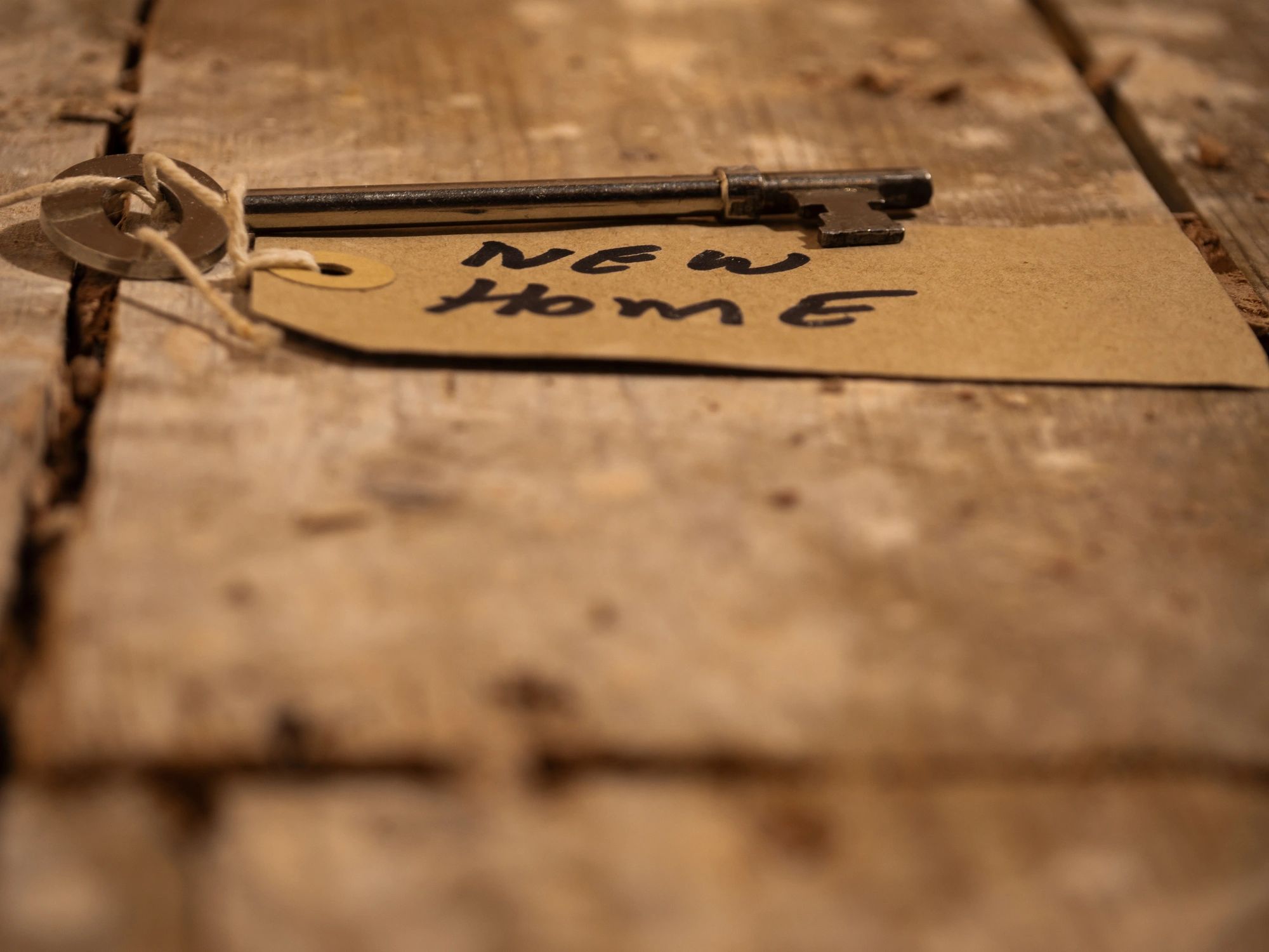 Vintage key on wooden boards suggesting puzzle solving and discovery