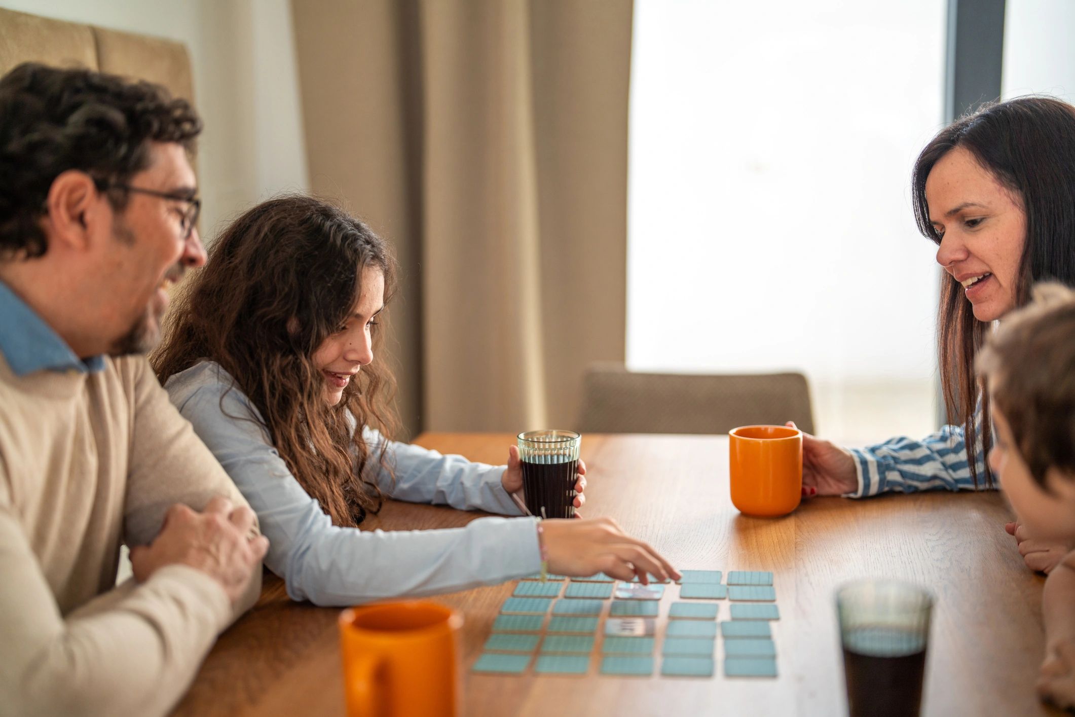 Family enjoying a printable mystery puzzle together