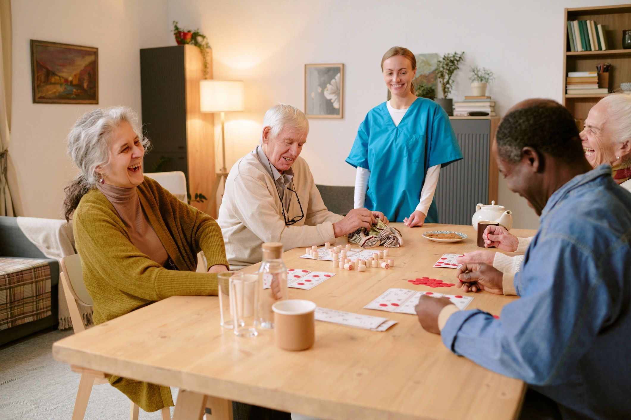 People gathered around a table playing a game together