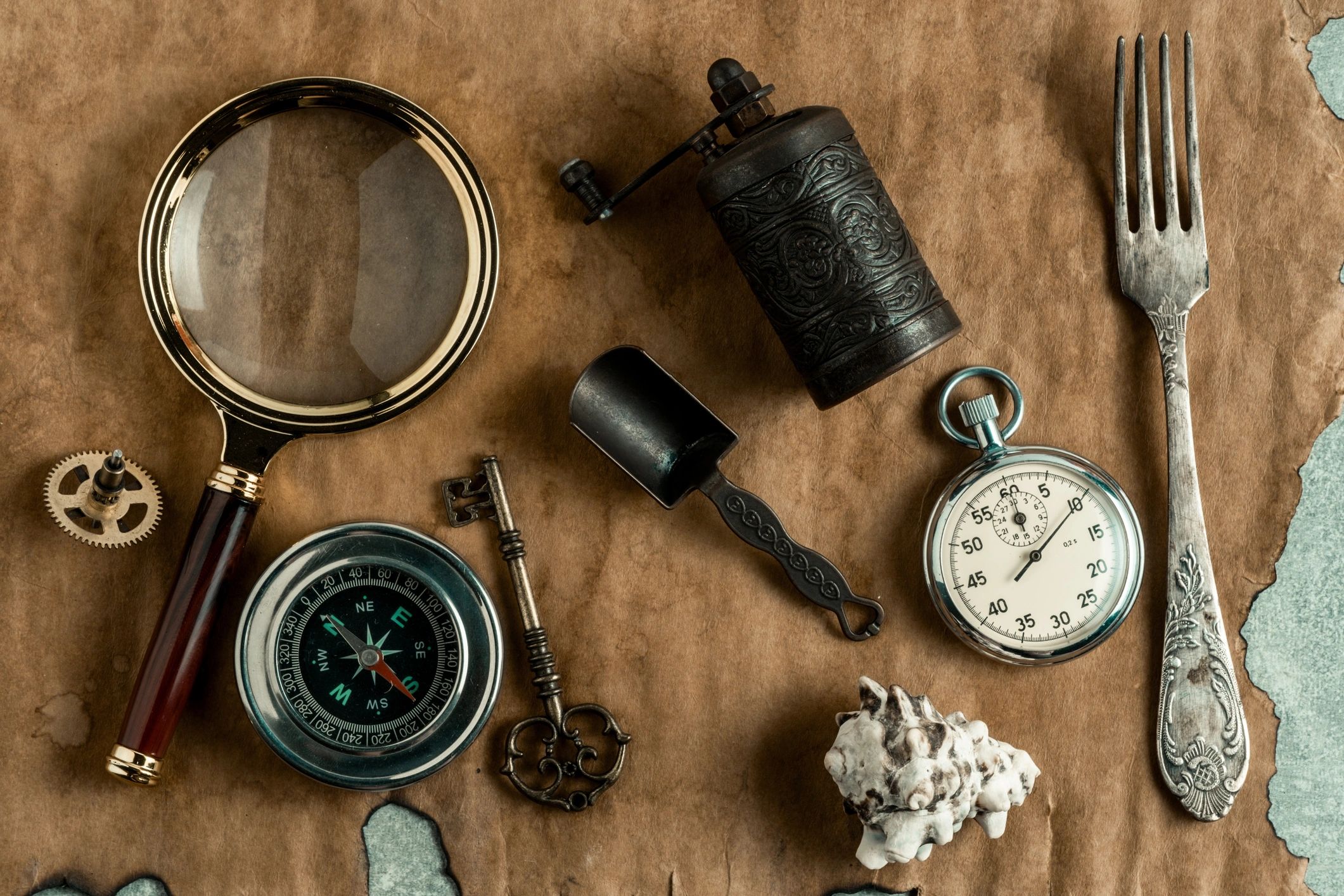 Detective-themed still life with magnifying glass and clue objects