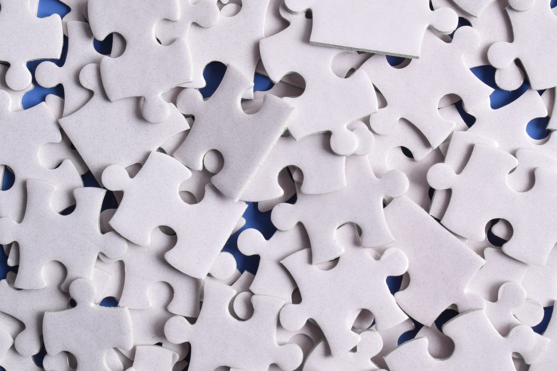 Pile of puzzle pieces representing premium word search packs