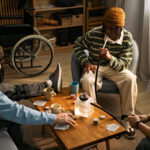 Teenagers with Disability Playing Cards during Social Gathering