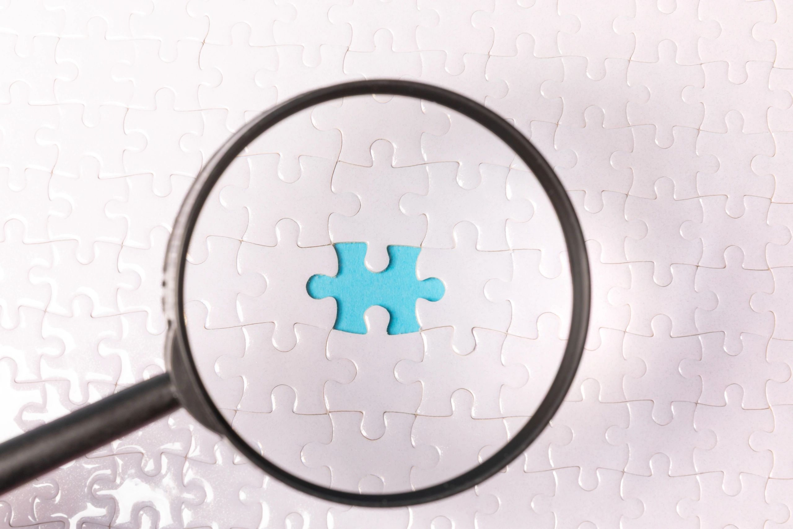 Magnifying glass and puzzle pieces for final call to action
